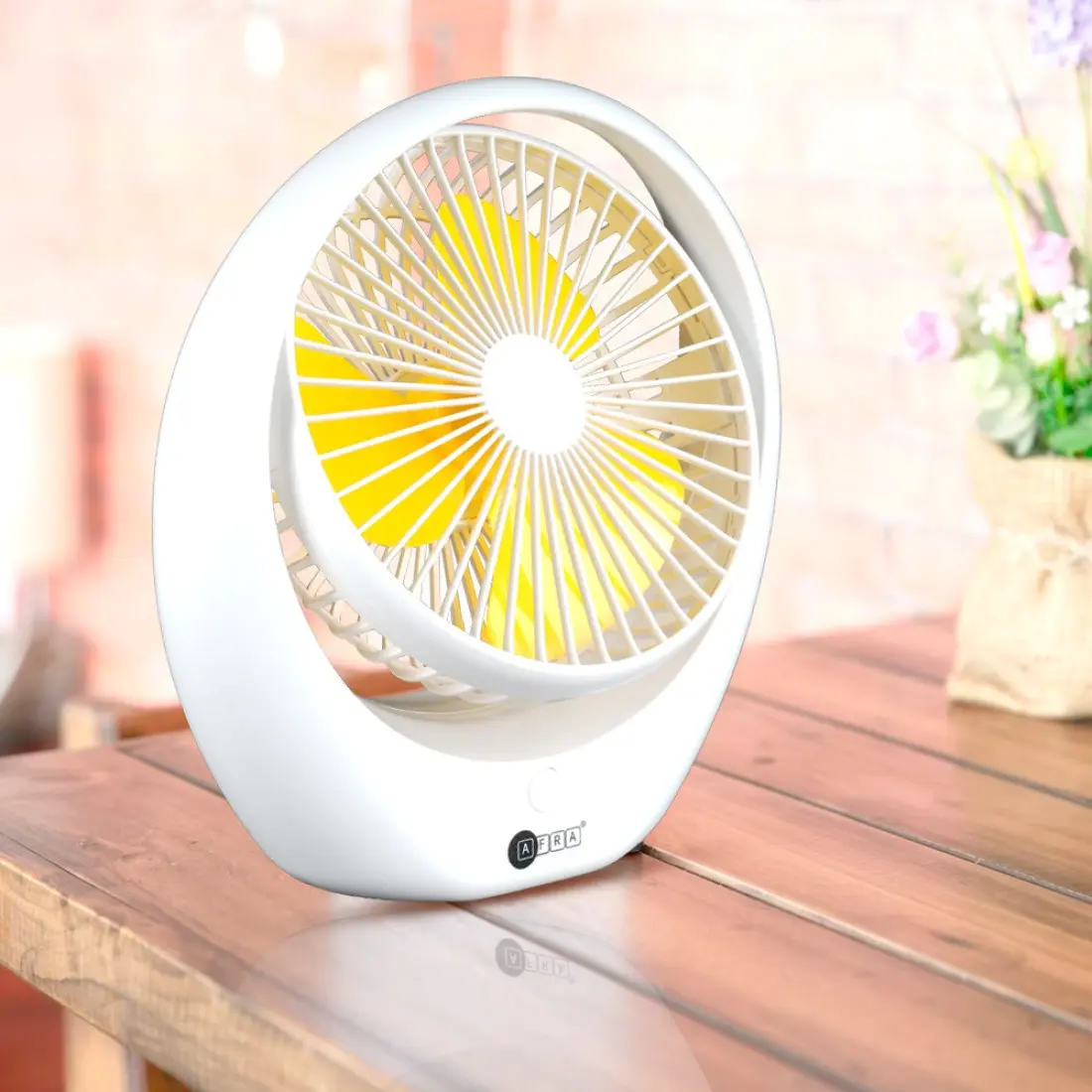 Portable rechargeable fan from Afra in a living room setup