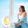 A young lady experiencing Portable rechargeable fan from Afra